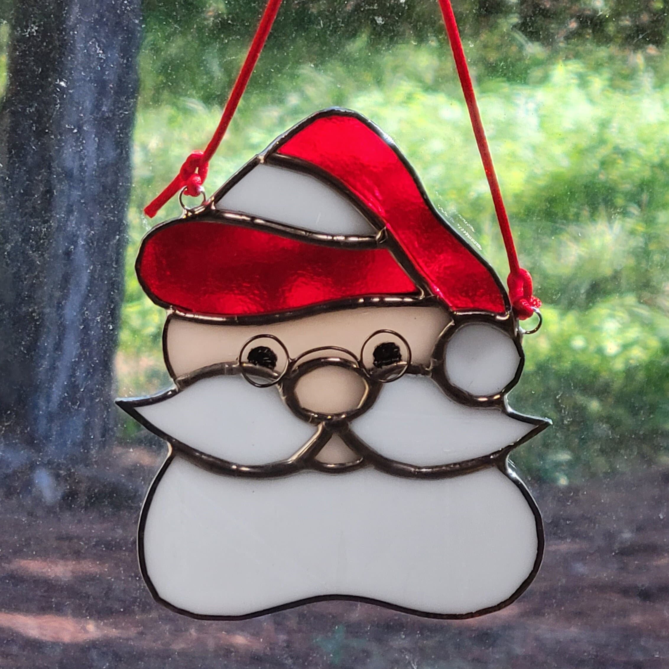 Beautifully crafted Stained Glass Santa Head Ornament - A Festive Touch for Your Holiday Decor