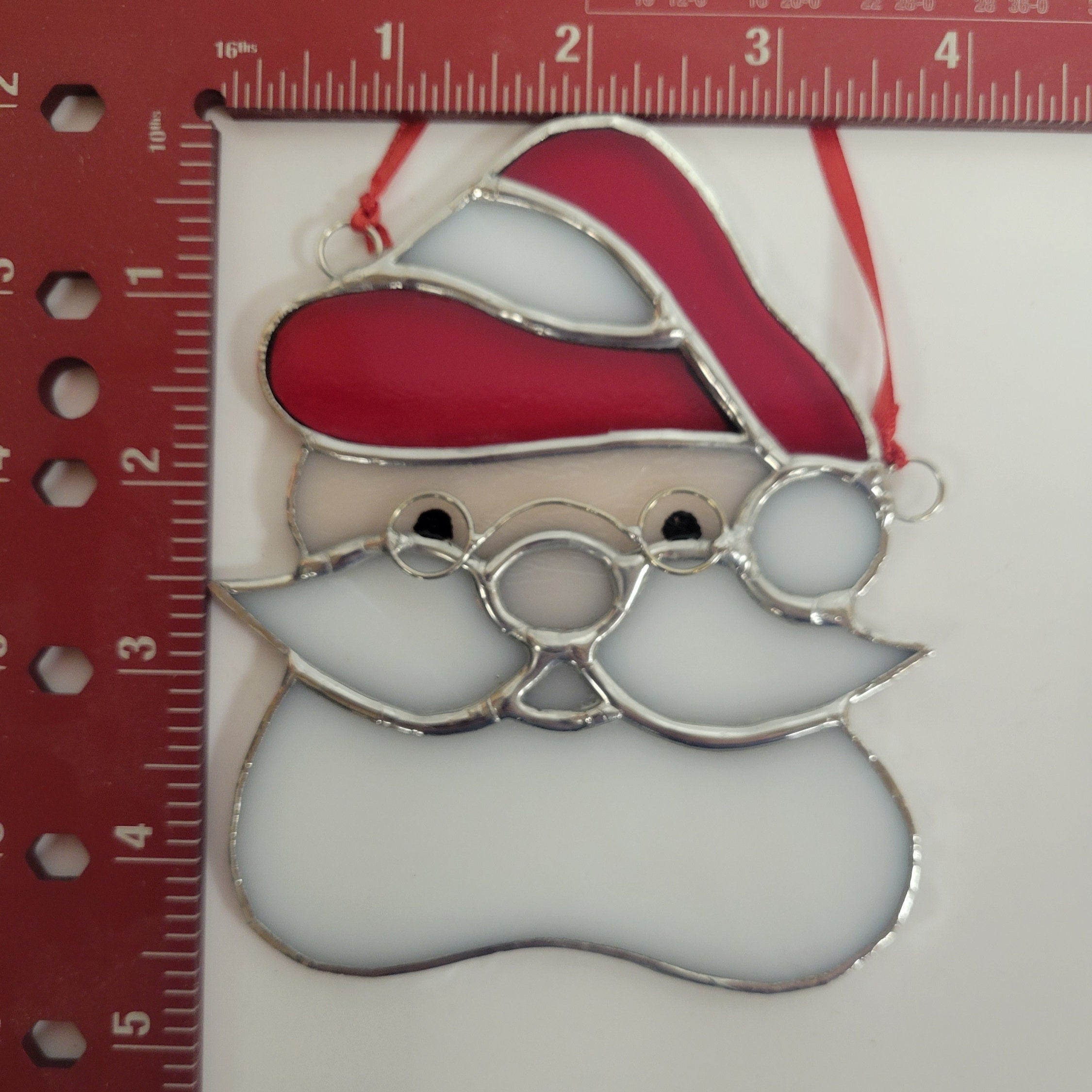 Beautifully crafted Stained Glass Santa Head Ornament - A Festive Touch for Your Holiday Decor